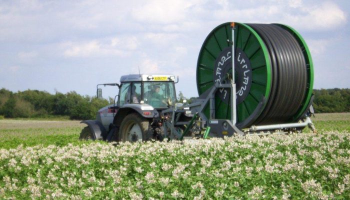 Ian moving an irrigator Ian moving an irrigator